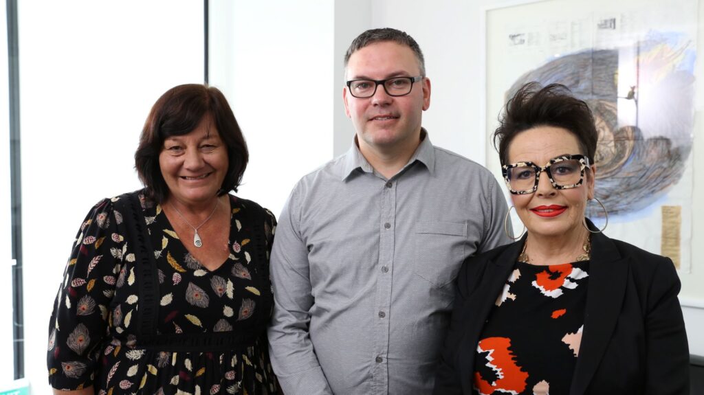 Jude Pauling (MySkill Learning and Development Team Leader) Dion Woodfield (MySkill Learner and Support Worker), Amanda Nicolle (Ministry of Social Development Director Industry Partnership) stand side by side.